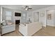 Bright living room features a fireplace, ceiling fan, and cozy seating at 1872 Stagecoach Trl, Wendell, NC 27591