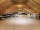 Spacious unfinished attic featuring exposed beams and mechanical equipment at 213 Big Bradley Dr, Wendell, NC 27591