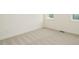 Neutral bedroom featuring plush carpeting and a large window for natural light at 213 Big Bradley Dr, Wendell, NC 27591