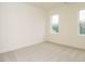 Bright bedroom featuring plush carpet and large windows with natural light at 213 Big Bradley Dr, Wendell, NC 27591