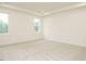 Bright bedroom with neutral carpet, tray ceilings, and two windows offering ample natural light at 213 Big Bradley Dr, Wendell, NC 27591