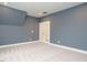 Bonus room featuring light carpet, fresh paint, and natural lighting at 213 Big Bradley Dr, Wendell, NC 27591