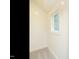 Cozy hallway featuring neutral carpet, a window, and simple, clean lines at 213 Big Bradley Dr, Wendell, NC 27591