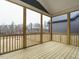 Screened porch with wood floors featuring an outdoor living space at 213 Big Bradley Dr, Wendell, NC 27591
