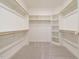 Organized walk-in closet with built-in shelves and rods, offering ample storage space at 213 Big Bradley Dr, Wendell, NC 27591