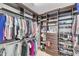 Spacious walk-in closet with custom shelving and ample storage for clothes, shoes, and accessories at 228 Virginia Water Dr, Rolesville, NC 27571