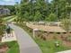 Well-maintained playground area with modern equipment surrounded by trees at 235 Augusta Pond Way # 161, Raleigh, NC 27603