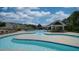 Outdoor swimming pool with ample lounge chairs and covered seating areas for residents at 235 Augusta Pond Way # 161, Raleigh, NC 27603