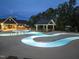 Community swimming pool with inviting lounge areas and covered seating for a relaxing experience at 235 Augusta Pond Way # 161, Raleigh, NC 27603