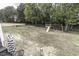 A spacious backyard with a playground and a chain-link fence, perfect for outdoor activities at 2570 Sweet Bay Rd, Rocky Mount, NC 27804