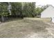 An expansive backyard featuring a chain-link fence and mature trees, offering privacy at 2570 Sweet Bay Rd, Rocky Mount, NC 27804