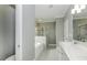 Bathroom includes double vanity, separate tub and glass shower, and tile floors at 2570 Sweet Bay Rd, Rocky Mount, NC 27804