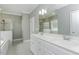 Primary bathroom includes a double vanity, a soaking tub, and a glass shower at 2570 Sweet Bay Rd, Rocky Mount, NC 27804