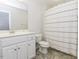 Clean bathroom featuring a vanity and tub shower combo with a curtain at 2570 Sweet Bay Rd, Rocky Mount, NC 27804