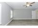 Grey bedroom with hard surface floors, ceiling fan, and bright natural light at 2570 Sweet Bay Rd, Rocky Mount, NC 27804