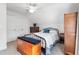 Bright bedroom with sloped ceiling, featuring a bed with an iron frame and wooden furniture at 2570 Sweet Bay Rd, Rocky Mount, NC 27804