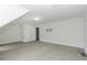 A spacious, carpeted bedroom with closet, doorway, ceiling light, and television mount at 2570 Sweet Bay Rd, Rocky Mount, NC 27804