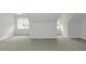 This carpeted bedroom features unique architectural ceiling lines, windows, and neutral colors at 2570 Sweet Bay Rd, Rocky Mount, NC 27804