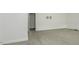 A spacious, carpeted bedroom with closet, doorway, and television mount at 2570 Sweet Bay Rd, Rocky Mount, NC 27804