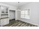 Bright dining area featuring a pendant light fixture and wood-look flooring at 2570 Sweet Bay Rd, Rocky Mount, NC 27804