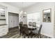 Bright dining area featuring a stylish chandelier and view into the kitchen at 2570 Sweet Bay Rd, Rocky Mount, NC 27804
