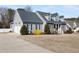 Charming home featuring a stone facade, dormer windows, manicured landscaping, and a two-car garage at 2570 Sweet Bay Rd, Rocky Mount, NC 27804