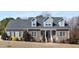Charming single-story home featuring a stone facade, dormer windows, and a well-maintained front yard at 2570 Sweet Bay Rd, Rocky Mount, NC 27804