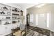 Elegant foyer featuring hardwood floors, built-in shelving, and a view of the front door at 2570 Sweet Bay Rd, Rocky Mount, NC 27804