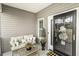 Cozy covered front porch with comfortable seating and decorative accents at 2570 Sweet Bay Rd, Rocky Mount, NC 27804