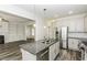 Open kitchen with granite countertops, stainless appliances, and view into living room at 2570 Sweet Bay Rd, Rocky Mount, NC 27804