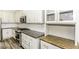 The kitchen features white cabinets, granite countertops, stainless steel appliances, and tile backsplash at 2570 Sweet Bay Rd, Rocky Mount, NC 27804