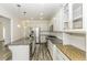 Bright kitchen features stainless appliances, granite countertops, white cabinets, and modern lighting at 2570 Sweet Bay Rd, Rocky Mount, NC 27804