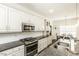 Updated kitchen featuring granite counters, stainless appliances, and views to the dining area at 2570 Sweet Bay Rd, Rocky Mount, NC 27804