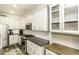 Gourmet kitchen featuring granite countertops, stainless steel appliances, and custom white cabinetry at 2570 Sweet Bay Rd, Rocky Mount, NC 27804
