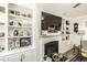 Cozy living room featuring a fireplace with built-in shelving at 2570 Sweet Bay Rd, Rocky Mount, NC 27804