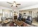 Open-concept living space with hardwood floors, neutral decor, and connection to the kitchen at 2570 Sweet Bay Rd, Rocky Mount, NC 27804