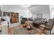 Inviting living room with an eclectic mix of seating, a patterned rug, and neutral walls at 2570 Sweet Bay Rd, Rocky Mount, NC 27804