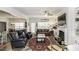 Open-concept living room featuring a fireplace, built-in shelving, and lots of natural light at 2570 Sweet Bay Rd, Rocky Mount, NC 27804