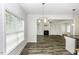 Spacious living room with fireplace and built-ins seen from the dining area at 2570 Sweet Bay Rd, Rocky Mount, NC 27804
