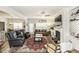 Spacious living room with fireplace, built-in shelves, hardwood floors and ample seating at 2570 Sweet Bay Rd, Rocky Mount, NC 27804