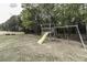 Backyard playground featuring slide, swings, and climbing structure at 2570 Sweet Bay Rd, Rocky Mount, NC 27804