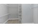 Bright walk-in closet with wire shelving and gray carpet for easy storage at 2570 Sweet Bay Rd, Rocky Mount, NC 27804