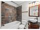 Stylish bathroom featuring warm tones, textured walls, and modern fixtures at 2603 Legion Ave, Durham, NC 27707