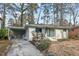 Charming brick home with a carport and light-blue accents at 2603 Legion Ave, Durham, NC 27707