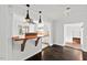 Stylish living room with hardwood floors, open to a modern kitchen area at 2603 Legion Ave, Durham, NC 27707