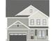 Charming two-story home with attached garage and covered front porch, showcasing a classic design and curb appeal at 268 Murray Grey Ln, Wake Forest, NC 27587