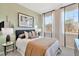 Comfortable bedroom with lots of natural light, decorative wallpaper, and stylish furniture at 2715 Hunter Woods Dr # 562, Apex, NC 27502