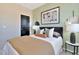 Inviting bedroom features a queen-size bed, patterned wallpaper, and modern decor elements at 2715 Hunter Woods Dr # 562, Apex, NC 27502