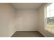 A cozy bedroom features natural light and gray flooring at 2715 Hunter Woods Dr # 562, Apex, NC 27502