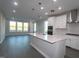 Bright, open-concept kitchen featuring a large island, stainless steel appliances, and plenty of counter space at 2715 Hunter Woods Dr # 562, Apex, NC 27502